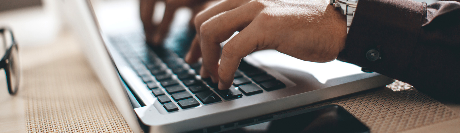 Person typing on laptop